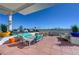 Inviting rooftop deck boasts comfortable furniture, outdoor dining, colorful planters, and an expansive city view at 150 Las Vegas Blvd # 1118, Las Vegas, NV 89101