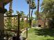 Lush backyard with artificial turf, desert landscaping, and a charming pergola feature at 1800 Quail Point Ct, Las Vegas, NV 89117