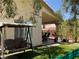 Picturesque backyard featuring well-maintained landscaping, a seating area, and mature trees for privacy at 1800 Quail Point Ct, Las Vegas, NV 89117