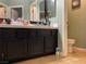 Bathroom with a long vanity, featuring generous countertop space and cabinet storage at 1800 Quail Point Ct, Las Vegas, NV 89117