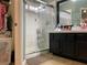 Bright bathroom featuring a glass-enclosed shower and ample storage at 1800 Quail Point Ct, Las Vegas, NV 89117
