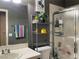 Bathroom with a shower, decorative accents, and storage shelves, offering both functionality and charm at 1800 Quail Point Ct, Las Vegas, NV 89117