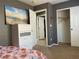 Cozy bedroom featuring a dresser with a serene ocean view artwork and a closet for ample storage at 1800 Quail Point Ct, Las Vegas, NV 89117