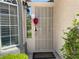 Close-up of a secure front door with stylish details and windows, adding curb appeal and security at 1800 Quail Point Ct, Las Vegas, NV 89117