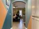Hallway leading to dining room, neutral walls, and cabinet storage at 1800 Quail Point Ct, Las Vegas, NV 89117