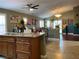 Open kitchen and dining area featuring a kitchen island and decorative lighting at 1800 Quail Point Ct, Las Vegas, NV 89117