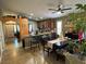 Spacious kitchen and dining area with barstool seating and warm, inviting lighting at 1800 Quail Point Ct, Las Vegas, NV 89117