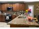 Well-equipped kitchen with modern appliances, granite countertops, and abundant cabinet space, ready for culinary adventures at 1800 Quail Point Ct, Las Vegas, NV 89117