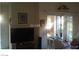 Bright living room with sliding glass doors providing natural light and balcony access at 2110 Los Feliz St # 1066, Las Vegas, NV 89156