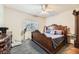 Serene main bedroom with ornate wood bed frame, soft carpet, and a window offering natural light at 2110 Los Feliz St # 1066, Las Vegas, NV 89156