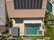 An aerial view highlights the backyard oasis, complete with a pool, spa, and covered patio area at 2400 Trissino Ct, Henderson, NV 89044