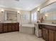 Bathroom offers and vanities and separate tub at 2400 Trissino Ct, Henderson, NV 89044