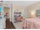 Cozy bedroom features a stylish desk, warm lighting, and comfortable decor for a peaceful retreat at 2400 Trissino Ct, Henderson, NV 89044