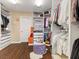 The walk-in closet has custom shelving and storage for shoes, bags and clothes at 2400 Trissino Ct, Henderson, NV 89044
