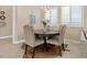 Breakfast nook featuring a charming table, upholstered chairs, and natural light at 2400 Trissino Ct, Henderson, NV 89044