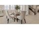 Dining area features a glass table with seating and an elegant decorative mirror at 2400 Trissino Ct, Henderson, NV 89044