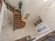 Grand foyer with a high ceiling, staircase, decorative chandelier, and a stylish front door at 2400 Trissino Ct, Henderson, NV 89044
