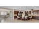 Open-concept kitchen and dining area perfect for entertaining, features dark wood cabinets at 2400 Trissino Ct, Henderson, NV 89044