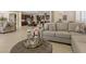 Spacious living room with neutral colors, plush seating, and open floor plan, perfect for entertaining and relaxation at 2400 Trissino Ct, Henderson, NV 89044