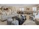 Spacious and inviting living room with comfortable seating, decorative accents, and an open floor plan, perfect for relaxing or entertaining at 2400 Trissino Ct, Henderson, NV 89044