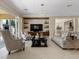 Cozy living space with stylish furniture, built-in storage, and access to the outdoors at 2400 Trissino Ct, Henderson, NV 89044
