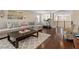 Large living room with hardwood floors, a gray area rug, and comfortable seating at 2400 Trissino Ct, Henderson, NV 89044