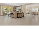 Comfortable living room with sliding glass doors, cozy seating, and an open layout, seamlessly blending indoor and outdoor living at 2400 Trissino Ct, Henderson, NV 89044