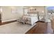 Main bedroom boasts a large bed, seating, and lots of natural light at 2400 Trissino Ct, Henderson, NV 89044