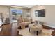 Bright and airy main bedroom sitting area boasts a private balcony with views at 2400 Trissino Ct, Henderson, NV 89044