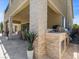 Stylish outdoor kitchen and patio create the perfect entertainment space with a built-in grill and ample counter space at 2400 Trissino Ct, Henderson, NV 89044