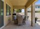 Enjoy dining in this outdoor patio with a built-in grill, perfect for hosting gatherings and enjoying the beautiful weather at 2400 Trissino Ct, Henderson, NV 89044