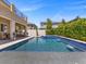 Beautiful backyard pool with spa and outdoor kitchen perfect for entertaining and relaxation under the sun at 2400 Trissino Ct, Henderson, NV 89044