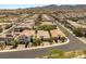 Aerial view of a suburban neighborhood showcasing well-maintained homes with tile roofs and landscaped yards at 2434 Quiet Ode St, Henderson, NV 89044