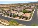 Aerial view of a suburban neighborhood, featuring tile roofs, desert landscaping, and orderly street layouts at 2434 Quiet Ode St, Henderson, NV 89044