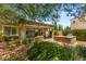 Beautiful backyard with a covered patio, built-in grill, and well-maintained lawn, ideal for outdoor gatherings at 2434 Quiet Ode St, Henderson, NV 89044