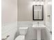 Powder room featuring pedestal sink, toilet, and decorative tile at 2434 Quiet Ode St, Henderson, NV 89044