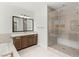 Bathroom vanity and glass shower with light tile at 2434 Quiet Ode St, Henderson, NV 89044