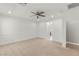 Spacious bedroom with neutral carpeting and a large paneled wall at 2434 Quiet Ode St, Henderson, NV 89044