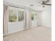 Bedroom with large windows, neutral carpet, and plenty of natural light at 2434 Quiet Ode St, Henderson, NV 89044