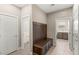 Hallway with built-in bench seating and multiple entryways at 2434 Quiet Ode St, Henderson, NV 89044