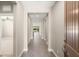 Long hallway leading to the bright, open living spaces, highlighting the home's seamless flow at 2434 Quiet Ode St, Henderson, NV 89044