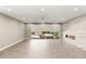 Inviting living room with expansive sliding glass doors, a modern fireplace, and plenty of natural light at 2434 Quiet Ode St, Henderson, NV 89044
