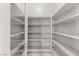 Walk-in pantry with ample shelving provides storage space at 2434 Quiet Ode St, Henderson, NV 89044