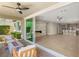 Inviting outdoor patio featuring a fire pit and a view of the spacious living area through sliding glass doors at 2434 Quiet Ode St, Henderson, NV 89044