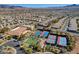 Aerial view of a community with tennis courts, bocce ball, a clubhouse, and desert landscaping at 2545 Nashira St, Henderson, NV 89044