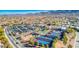 Aerial view showcasing the community amenities, including tennis courts and recreation areas at 2545 Nashira St, Henderson, NV 89044