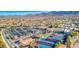 Wide aerial shot showcasing tennis courts, recreation areas, clubhouse and desert landscape at 2545 Nashira St, Henderson, NV 89044