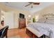 Comfortable main bedroom features a ceiling fan, ensuite bathroom and stylish furnishings at 2545 Nashira St, Henderson, NV 89044