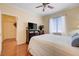 Bedroom with hardwood flooring, natural light, neutral walls, and ceiling fan at 2545 Nashira St, Henderson, NV 89044