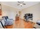 Bright bedroom featuring hardwood floors, a ceiling fan, and neutral walls at 2545 Nashira St, Henderson, NV 89044